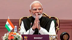 Prime Minister Narendra Modi greets the gathering during the 18th BRICS Summit, at the Bharat Mandapam, in New Delhi. - | Photo: @NarendraModi/YT via PTI