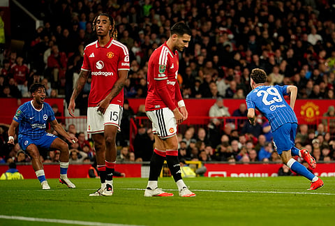 Brighton's Maxim De Cuyper, right, celebrates after scoring his side's third goal during the English League Cup third round soccer match between Manchester United and Brighton and Hove Albion in Manchester, England, Wednesday, Sept. 16, 2026. 