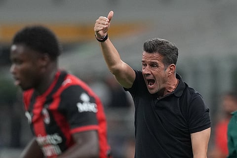Benfica's head coach Marco Silva gestures during the Europa League opening phase soccer match between AC Milan and Benfica in Milan, Italy.