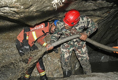 Nepalese soldiers undertake a search and rescue operation at the Chilime hydropower project following earlier flash floods in Nepal's Rasuwa district, Wednesday, Sept. 16, 2026. 