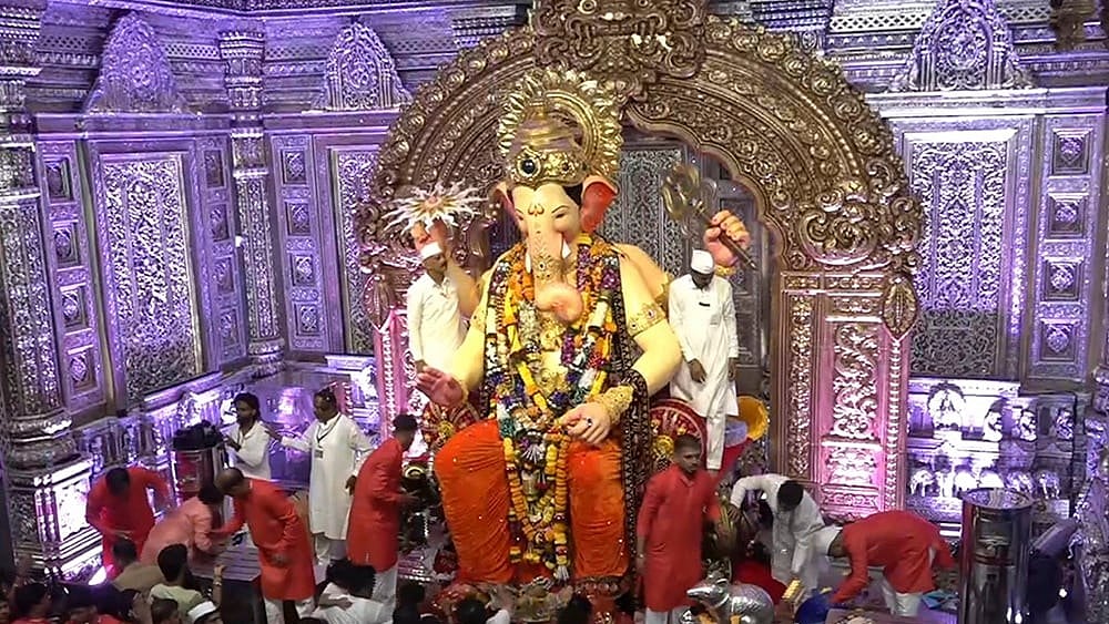 People offer prayers at Lalbaugcha Raja during 'Ganesh Chaturthi' festival, in Mumbai, Monday, Sept. 14, 2026.  - | Photo: PTI