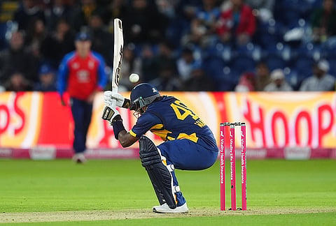 Sri Lanka's Wanindu Hasaranga ducks under a bouncer from England's Jamie Overton during the second IT20 match between England and Sri Lanka in Cardiff, Wales, Thursday Sept. 17, 2026. 