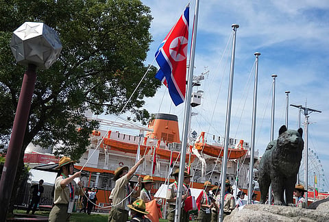 Officials rehearse ahead of a flag raising ceremony at the athletes village ahead of the Asian Games in Nagoya, Japan, Friday, Sept. 18, 2026. 