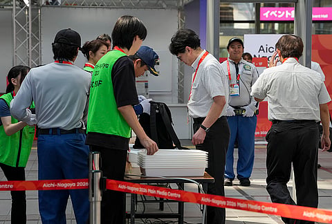Security checks underway at media center set up for the Asian Games 2026, in Nagoya, Japan, Thursday, Sept. 17, 2026. 