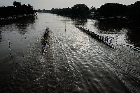 Participants take part in the traditional boat race on the Kulsi river in Champupara village, west of Guwahati, India.