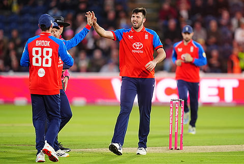 England's Jamie Overton, right, celebrates after taking the wicket of Sri Lanka's Pathum Nissanka during the second IT20 match between England and Sri Lanka in Cardiff, Wales, Thursday Sept. 17, 2026.
