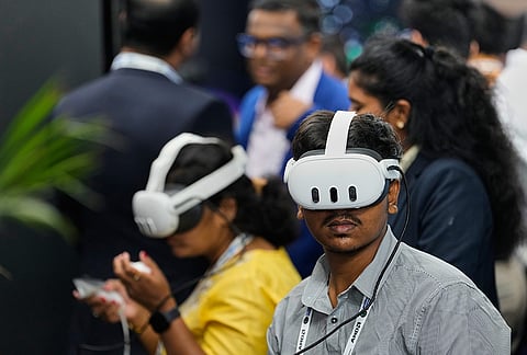 Delegates take a virtual reality tour of Micron company during semiconductor technologies exhibition by Indian and international companies at Semicon India 2026 in New Delhi, India, Friday, Sept. 18, 2026. 