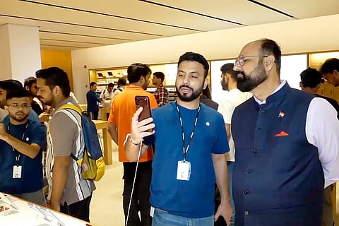 People check the latest models iPhone 18 Pro and iPhone 18 Pro Max during its official sales launch in India, at Select Citywalk Mall, in New Delhi.