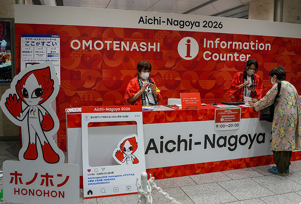 Officials provide assistance at an information centre as the city prepares for the 20th Asian Games, at the railway station in Nagoya, Japan, Thursday, Sept. 17, 2026.  - | Photo: PTI/Arun Sharma