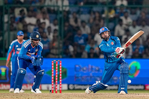 Afghanistan's Mohammed Nabi plays a shot during the third and final T20I cricket match between India and Afghanistan, in New Delhi.