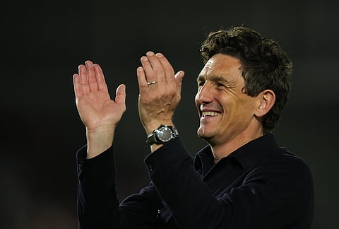 Brentford's head coach Keith Andrews wlaks off the pitch after the Premier League soccer match between Brentford and Chelsea in London, England, Friday, Sept. 18, 2026. 