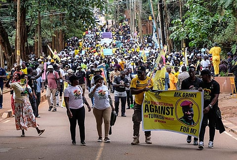 Members of the Patriotic League of Uganda demonstrate outside the Turkish Embassy demanding the extradition of a dissident, Fred Lumbuye, whose online activities are seen by local authorities as anti-government propaganda in Kampala, Uganda, Friday, Sept. 18, 2026. 
