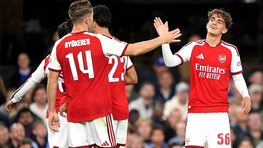 Arsenal's Max Dowman, right, celebrates scoring their side's third goal during the League Cup third round soccer match between Ipswich Town and Arsenal in Ipswich, England. - Joe Giddens/AP Photo