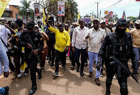 Twalla Fadil, in yellow General Secretary of Patriotic League of Uganda and other members demonstrated outside the Turkish Embassy demanding the extradition of a dissident, Fred Lumbuye, whose online activities are seen by local authorities as anti-government propaganda in Kampala, Uganda, Friday, Sept. 18, 2026.
