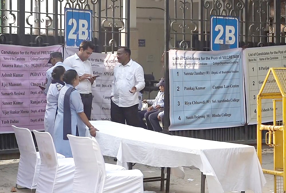 Security personnel and officials during the counting of vote for the Delhi University Students’ Union (DUSU) elections as it gets underway amid heightened security, in New Delhi, Saturday, Sept. 19, 2026. 
