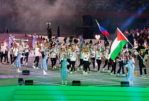 Palestinian athletes march into the stadium during the opening ceremony for the Asian Games in Nagoya, Japan, Saturday, Sept. 19, 2026. 