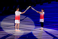 Asiad 2026 Opening Ceremony: Games Officially Declared Open In Aichi-Nagoya By Emperor Naruhito | Photo: PTI/Arun Sharma : Japan's Ayaka Takahashi, right, and others, carry the torch during the opening ceremony of the 20th Asian Games, in Nagoya, Japan, Saturday, Sept. 19, 2026.
