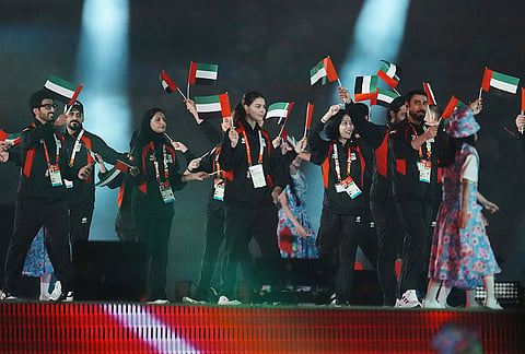 United Arab Emirates' athletes walk into the stadium during the opening ceremony for the Asian Games in Nagoya, Japan, Saturday, Sept. 19, 2026. 