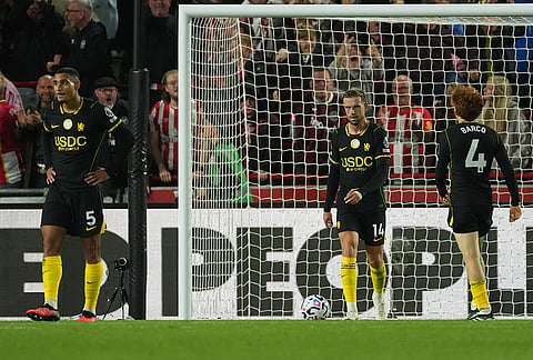 Chelsea players stand dejected after conceiding third goal during the Premier League soccer match between Brentford and Chelsea in London, England, Friday, Sept. 18, 2026. 