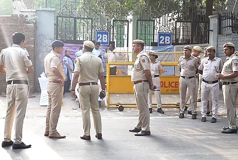 Police personnel stand guard as counting of votes for the Delhi University Students’ Union (DUSU) elections gets underway amid heightened security, in New Delhi.