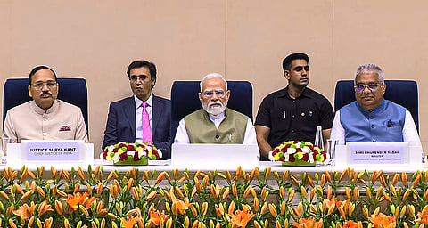 Prime Minister Narendra Modi with Chief Justice of India (CJI) Surya Kant, left, and Union Environment, Forest and Climate Change Minister Bhupender Yadav, right, during the inauguration of the International Conference on ‘The Future of Environment and Climate Dynamics’, at Vigyan Bhawan, in New Delhi. 