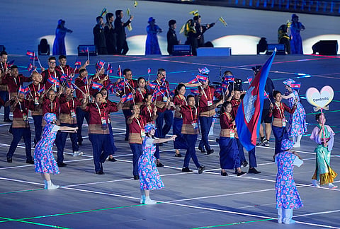 Cambodian athletes walk into the stadium during the opening ceremony for the Asian Games in Nagoya, Japan, Saturday, Sept. 19, 2026. 