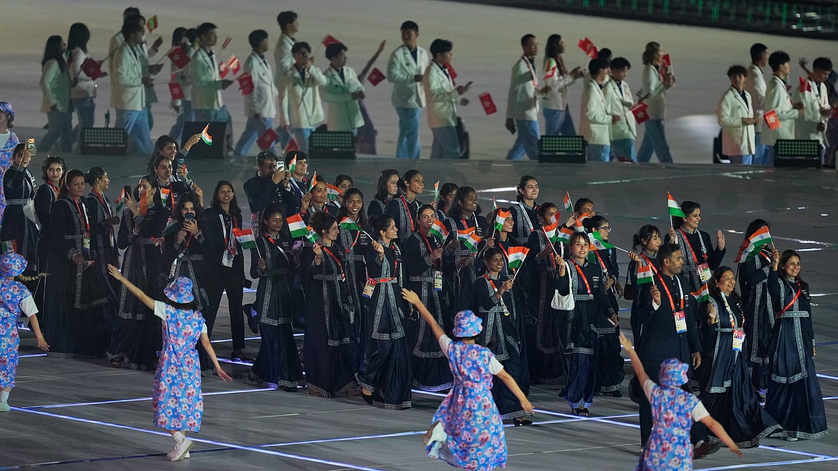 Indian athletes react as they walk into the stadium during the opening ceremony for the Asian Games in Nagoya, Japan, Saturday, Sept. 19, 2026. - (AP Photo/Dita Alangkara)