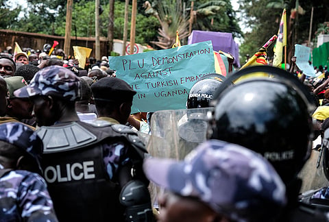 Members of the Patriotic League of Uganda demonstrate outside the Turkish Embassy demanding the extradition of a dissident, Fred Lumbuye, whose online activities are seen by local authorities as anti-government propaganda in Kampala, Uganda, Friday, Sept. 18, 2026. 
