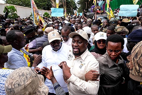 Members of the Patriotic League of Uganda demonstrate outside the Turkish Embassy demanding the extradition of a dissident, Fred Lumbuye, whose online activities are seen by local authorities as anti-government propaganda in Kampala, Uganda, Friday, Sept. 18, 2026. 