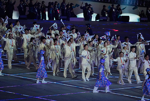South Korean athletes react as they walk into the stadium during the opening ceremony for the Asian Games in Nagoya, Japan, Saturday, Sept. 19, 2026. 