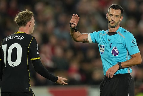 Chelsea's Cole Palmer argues with a referee during the Premier League soccer match between Brentford and Chelsea in London, England, Friday, Sept. 18, 2026.
