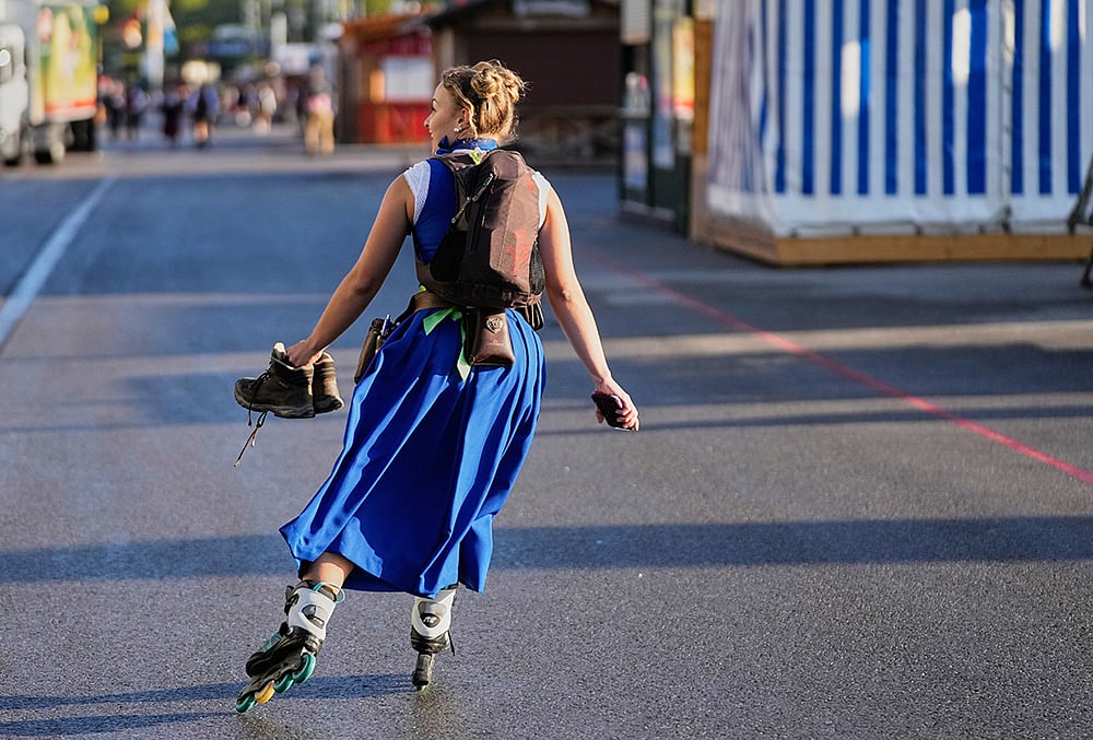 waitresses skates to work prior to the opening of the 191st Oktoberfest beer festival 