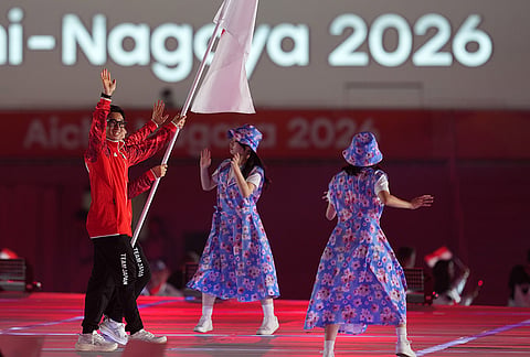 Japan's flag bearers Fujinami Akari and Nakamura Rimu walk during the opening ceremony for the Asian Games in Nagoya, Japan, Saturday, Sept. 19, 2026.