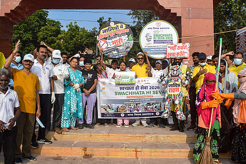 People take part in an awareness rally on the occasion of World Cleanup Day at Dashashwamedh Ghat, in Prayagraj, Uttar Pradesh.