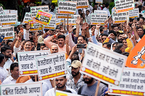 Bharatiya Janata Party (BJP) workers stage a protest demanding the expulsion of AAP councillor Vijay Kumar over allegations linked to MCD sanitation worker’s suicide, in New Delhi.