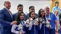 India At Asian Games 2026 Medal Tally: Where Does IND Stand After Day 2? Photo: PTI/Atul Yadav : Front row from left, India's Vidarsa Vinod, Sonam Maskar and Elavenil Valarivan pose for photographers with others after winning silver medals in the 10m Air Rifle Women Team Final event during the 20th Asian Games, in Nagoya, Japan.