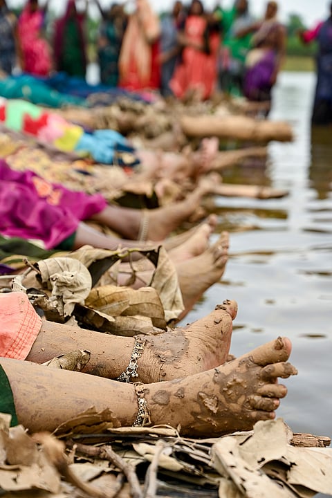 Displaced villagers affected by the 'Ken-Betwa', 'Majhgawan', and 'Runjh' river interlinking projects stage a symbolic 'Chita Andolan' protest on funeral pyres to demand compensation and rehabilitation following home submersions, in Panna, Madhya Pradesh.