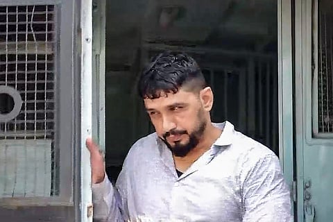 Gangster Sandeep, also known as Kala Jathedi, steps out of Tihar Jail on custody parole to attend the naming ceremony of his newborn daughters, in Sonipat.
