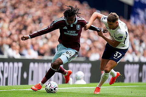 Aston Villa's Johan Manzambi, left, and Tottenham Hotspur's Micky van de Ven challenge for the ball during the English Premier League soccer match between Tottenham Hotspur and Aston Villa, at Tottenham Hotspur Stadium in London.