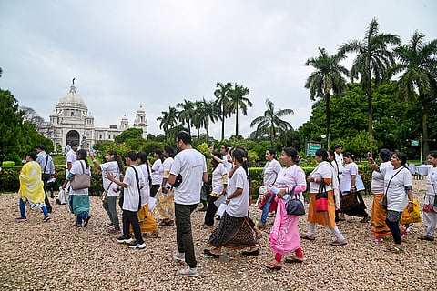 People take part in 'Vishwa Shanti Yatra 2026', a march dedicated to promote peace,harmony and collective well-being, organised by Akhil Bharatiya Adhyatmik Samiti, at Vitoria Memorial, in Kolkata.