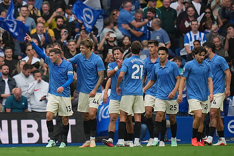Brighton players celebrate first goal during the English Premier League soccer match between Brighton & Hove Albion and Arsenal in Brighton, England.