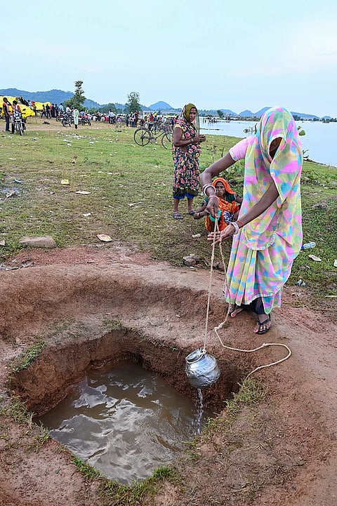 Displaced villagers affected by the 'Ken-Betwa', 'Majhgawan', and 'Runjh' river interlinking projects stage a symbolic 'Chita Andolan' protest on funeral pyres to demand compensation and rehabilitation following home submersions, in Panna, Madhya Pradesh, Saturday, Sept. 19, 2026.