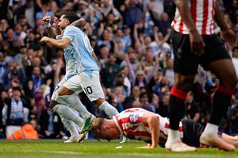 Manchester City's Enzo Fernandez, left, and Cherki celebrate second goal during the English Premier League soccer match between Manchester City and Sunderland in Manchester, England.