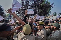 In Photos | Apni Party Protests in Srinagar, Seeks Transparency on J&K Reservation Policy | Photo: AP/Mukhtar Khan : A supporter of the Jammu Kashmir Apni Party shouts slogans against the ruling government as police officers try to stop him during a protest demanding jobs, opposing a power tariff hike and pressing other demands in Srinagar, Kashmir.