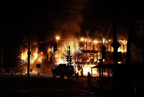 Rescue workers put out a fire at the Intrade trade center after a Russian drone strike on Zaporizhzhia, Ukraine, Monday, Sept. 21, 2026.
