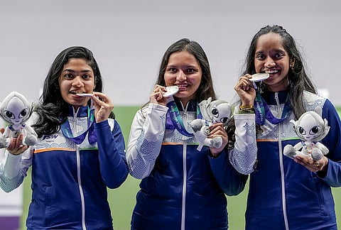 From left, India's Vidarsa Vinod, Sonam Maskar and Elavenil Valarivan pose for photographers after winning silver medals in the 10m Air Rifle Women Team Final event during the 20th Asian Games, in Nagoya, Japan, Sunday, Sept. 20, 2026. 