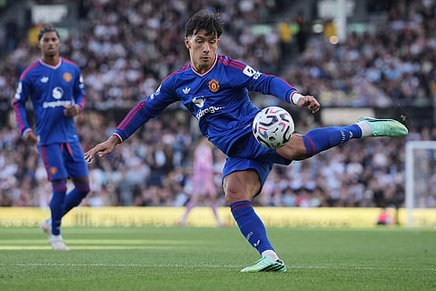 Manchester United's Lisandro Martinez kicks the ball during the English Premier League soccer match between Fulham and Manchester United in London.