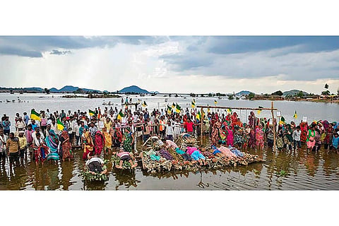 Displaced villagers affected by the 'Ken-Betwa', 'Majhgawan', and 'Runjh' river interlinking projects stage a symbolic 'Chita Andolan' protest on funeral pyres to demand compensation and rehabilitation following home submersions, in Ajaygarh tehsil, Panna district, Madhya Pradesh, Wednesday, Sept. 16, 2026.