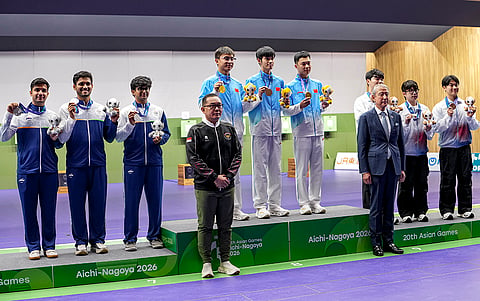 India’s Himanshu Dhillon, Rudrankksh Patil, Parth Rakesh Mane, Silver Medal, China's Zhang Changhog, MA Sihan, Sheng Liao, Gold medal, Korea's Shin Minki, Park Hajun and Gyon Hyeopjun pose for photographs after the 10 meter rifle men team event in the ongoing 20th Asian Games 2026, in Nagoya, Japan, Monday, Sept. 21, 2026.
