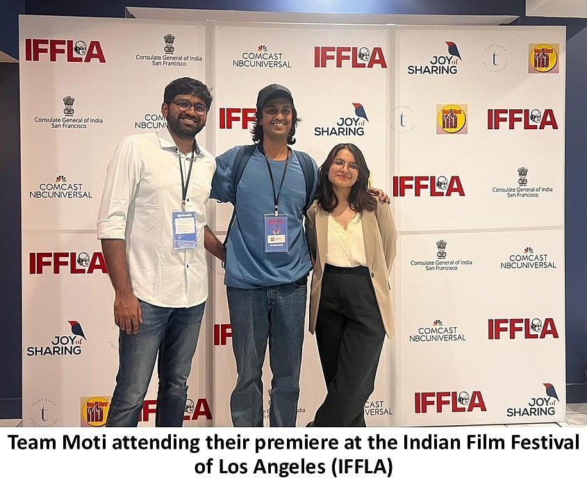 Three people posing in front of an IFFLA backdrop